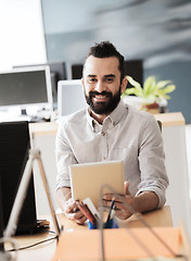 Image showing happy creative male office worker with tablet pc