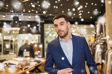 Image showing young handsome man in jacket at clothing store