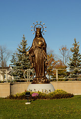 Image showing A tall bronze statue of Mother Mary.