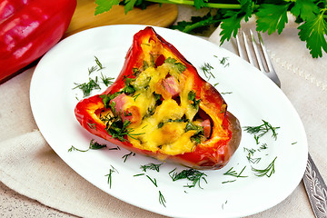 Image showing Pepper stuffed with sausage and cheese on granite table