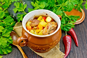 Image showing Roast meat and potatoes in portion pot on board