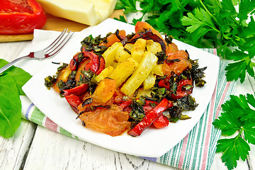 Image showing Courgettes with vegetables in plate on table