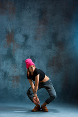 Image showing Young girl break dancing on wall background.