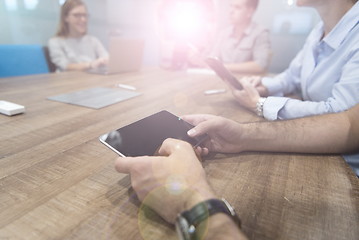 Image showing close up of businessman on meeting using tablet