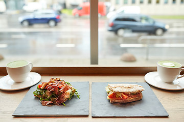 Image showing salad, sandwich and matcha green tea at restaurant