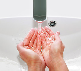 Image showing washing hands in sink