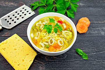 Image showing Soup Minestrone in white bowl on black board