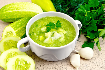 Image showing Soup cucumber in white bowl on granite table