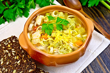 Image showing Soup Minestrone in clay bowl on board