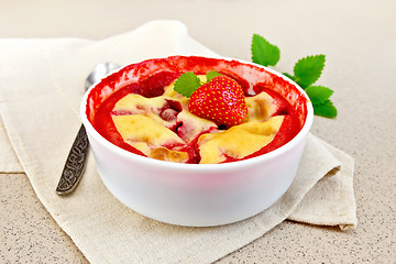 Image showing Pudding strawberry in bowl on stone table