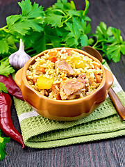 Image showing Rice with chicken and zucchini in bowl on napkin