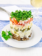 Image showing Salad with beef and tomato on blue tablecloth