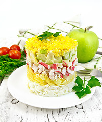 Image showing Salad of crab sticks on board