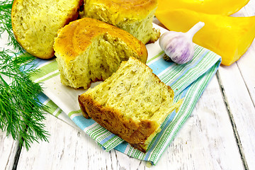 Image showing Scones pumpkin with garlic on towel