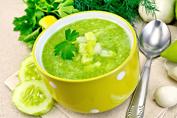 Image showing Soup cucumber in yellow bowl on granite table