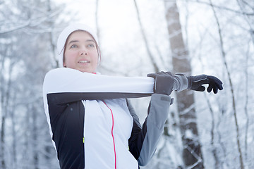 Image showing Sport brunette on stretching exercises