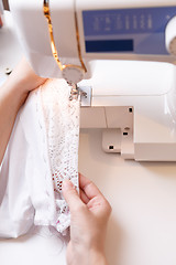 Image showing Photos of sewing-machine, hands girl