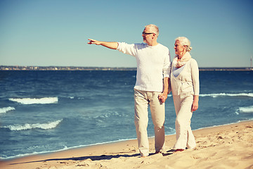 Image showing happy senior couple on summer beach