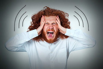 Image showing Stressed businessman with a headache