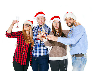 Image showing Many young women and men drinking at christmas party