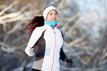 Image showing Young brunette engaged in running