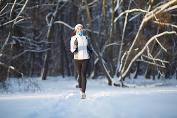 Image showing Woman on jogging in winter