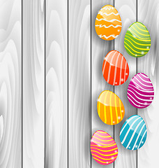 Image showing Easter glossy colorful eggs on grey wooden texture