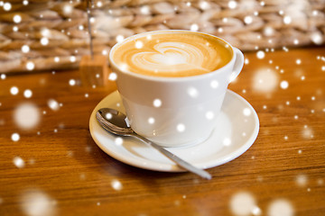 Image showing close up of coffee cup with heart shape drawing