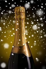 Image showing close up of champagne bottle with golden label