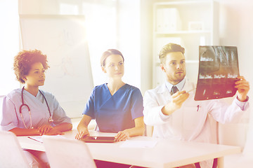 Image showing group of doctors discussing x-ray image