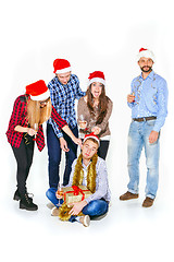 Image showing Many young women and men drinking at christmas party