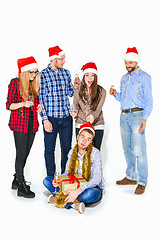 Image showing Many young women and men drinking at christmas party