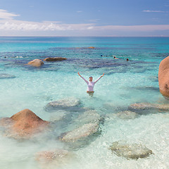 Image showing Woman enjoying Anse Lazio picture perfect beach on Praslin Island, Seychelles.