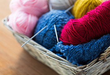 Image showing basket with knitting needles and balls of yarn