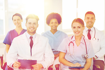 Image showing group of happy doctors on seminar at hospital