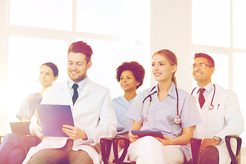 Image showing group of happy doctors on seminar at hospital