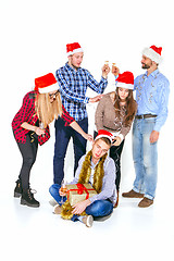 Image showing Many young women and men drinking at christmas party