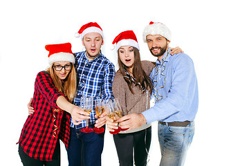 Image showing Many young women and men drinking at christmas party