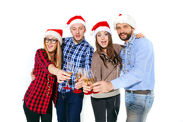 Image showing Many young women and men drinking at christmas party