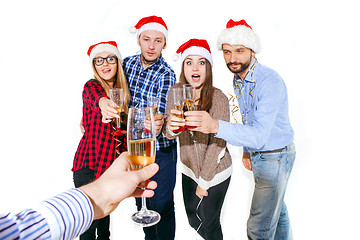 Image showing Many young women and men drinking at christmas party