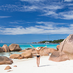 Image showing Woman enjoying Anse Lazio picture perfect beach on Praslin Island, Seychelles.