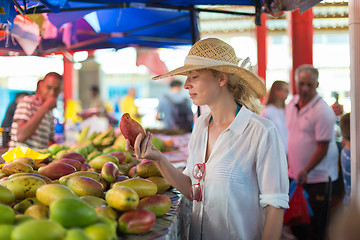 Image showing Traveler shopping on traditional Victoria food market, Seychelles.