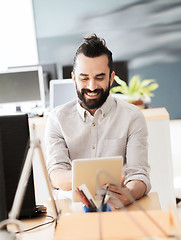 Image showing happy creative male office worker with tablet pc