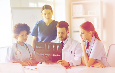 Image showing group of doctors discussing x-ray image