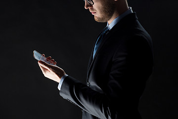 Image showing close up of businessman with glass smartphone