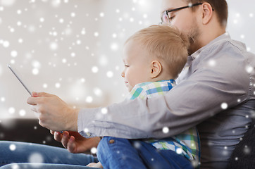 Image showing father and son with tablet pc playing at home