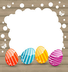 Image showing Holiday card with Easter colorful eggs on wooden background