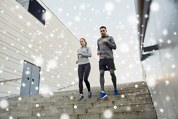 Image showing couple of sportsmen walking downstairs