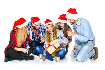 Image showing Many young women and men drinking at christmas party