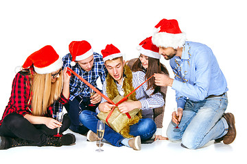 Image showing Many young women and men drinking at christmas party